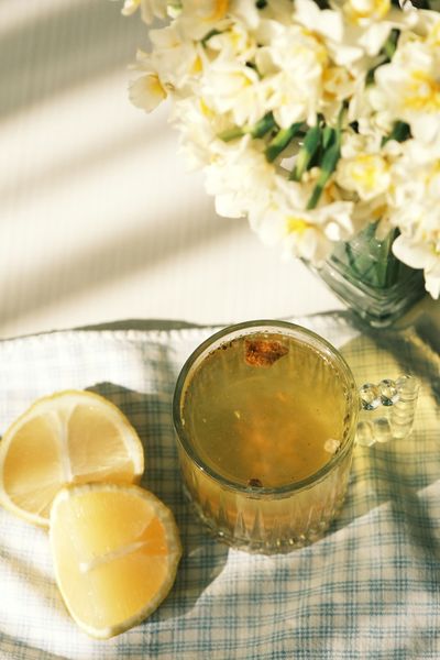 Lemon herbal tea on a sunlit table
